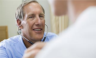 Doctor using stethoscope