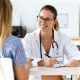 Female doctor sitting across from a patient